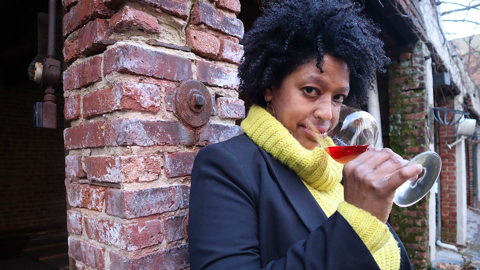 Madeline Maldonado nosing a glass of red wine